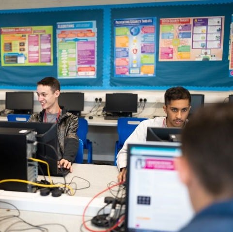 Students using computers in a classroom 
