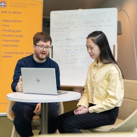 Student talking to adviser 