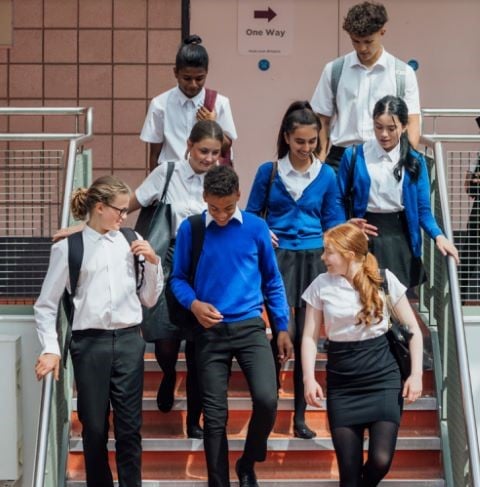 Students walking down staircase