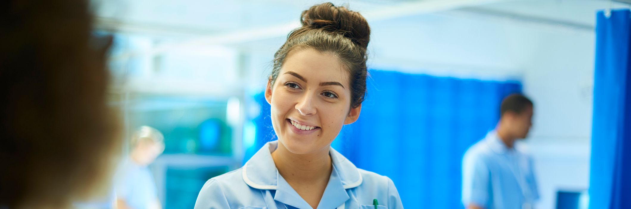 Female apprentice nurse on ward