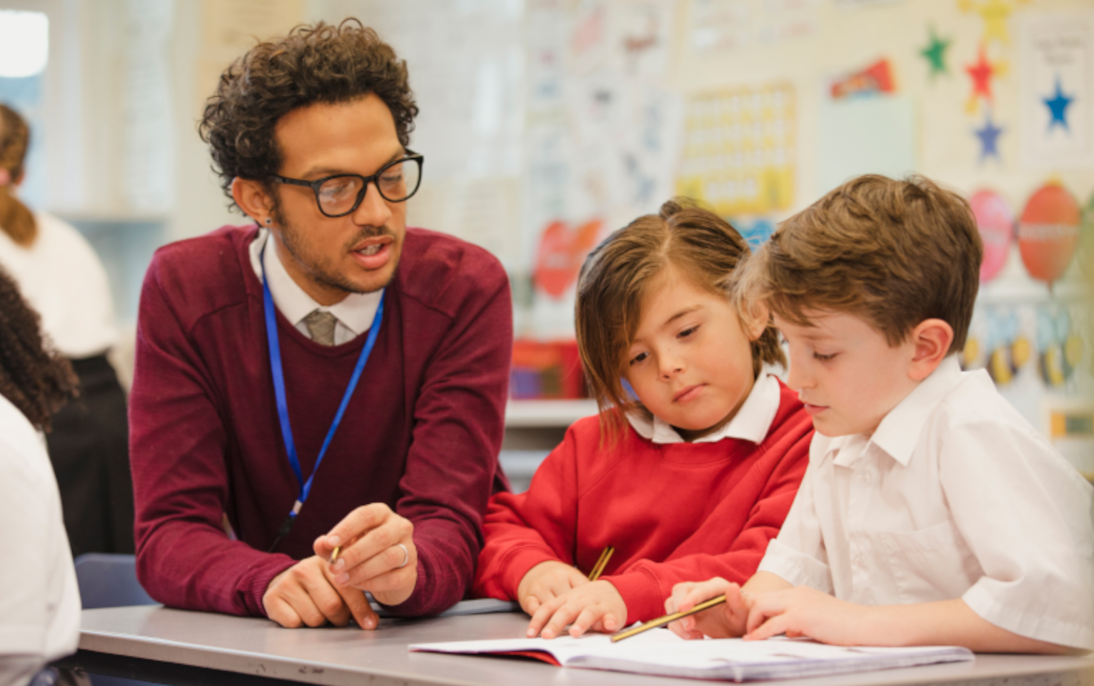 Photo of teacher and two pupils