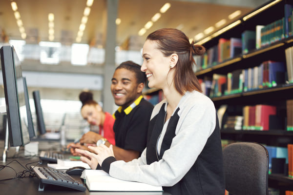 Students using PCs in library