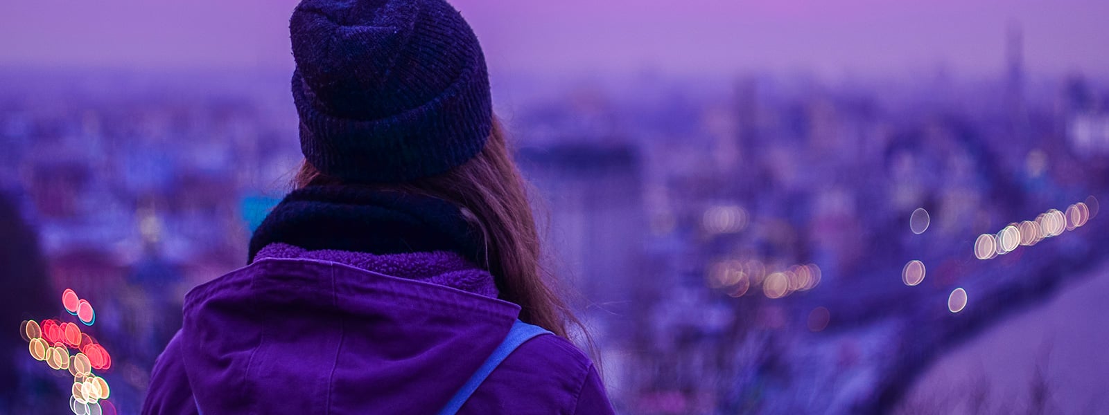 Person looking over a city