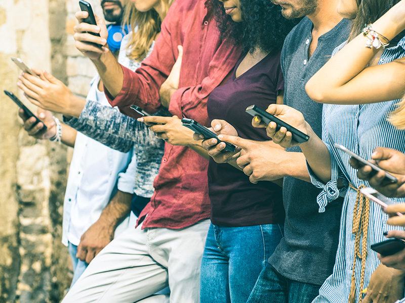 A line of students all on mobile devices