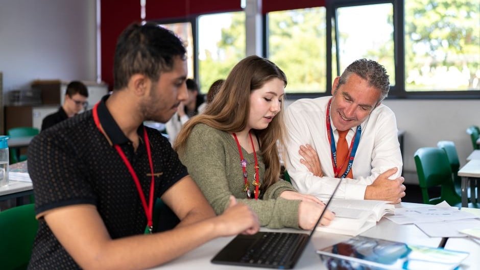 Adviser chatting with students