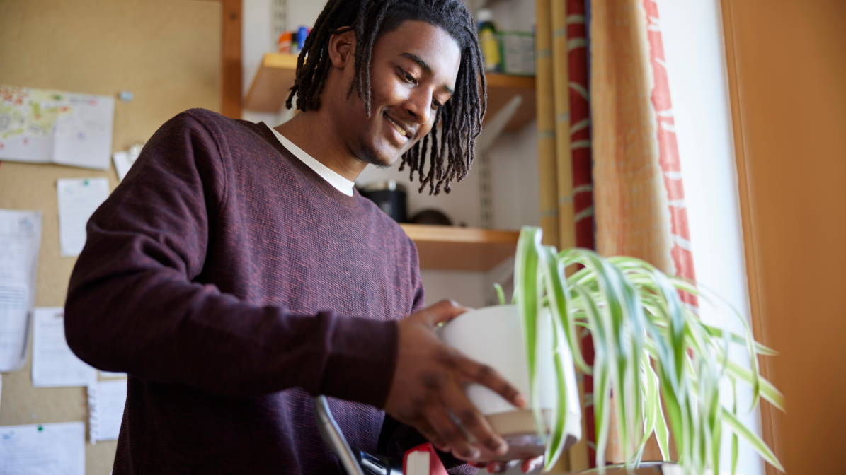 A student unpacking items in their university accommodation