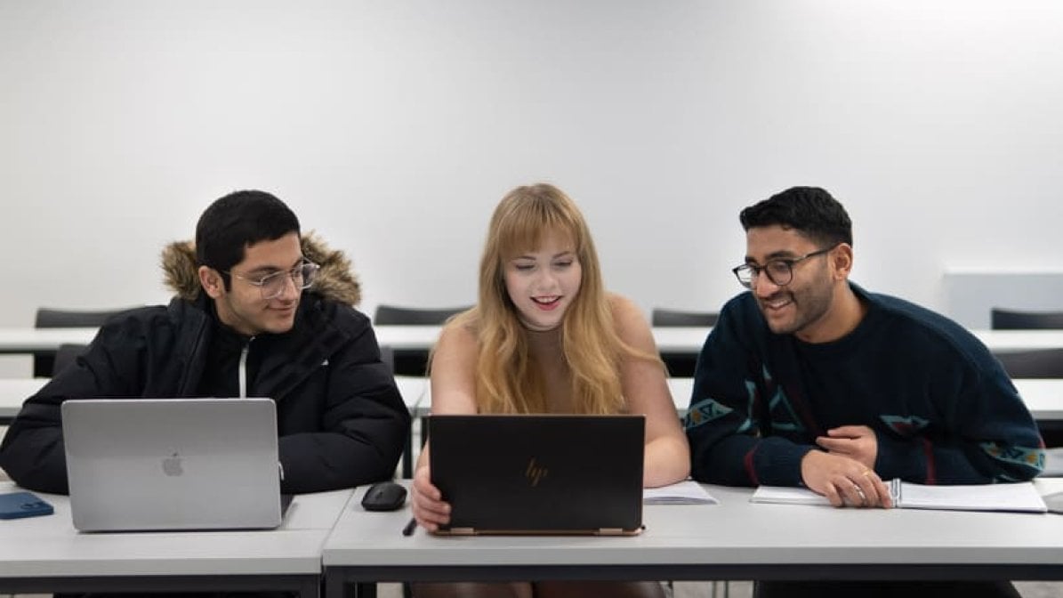 Students looking at the UCAS Hub on their laptops