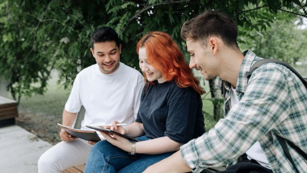 Clearing students checking vacancies on laptop