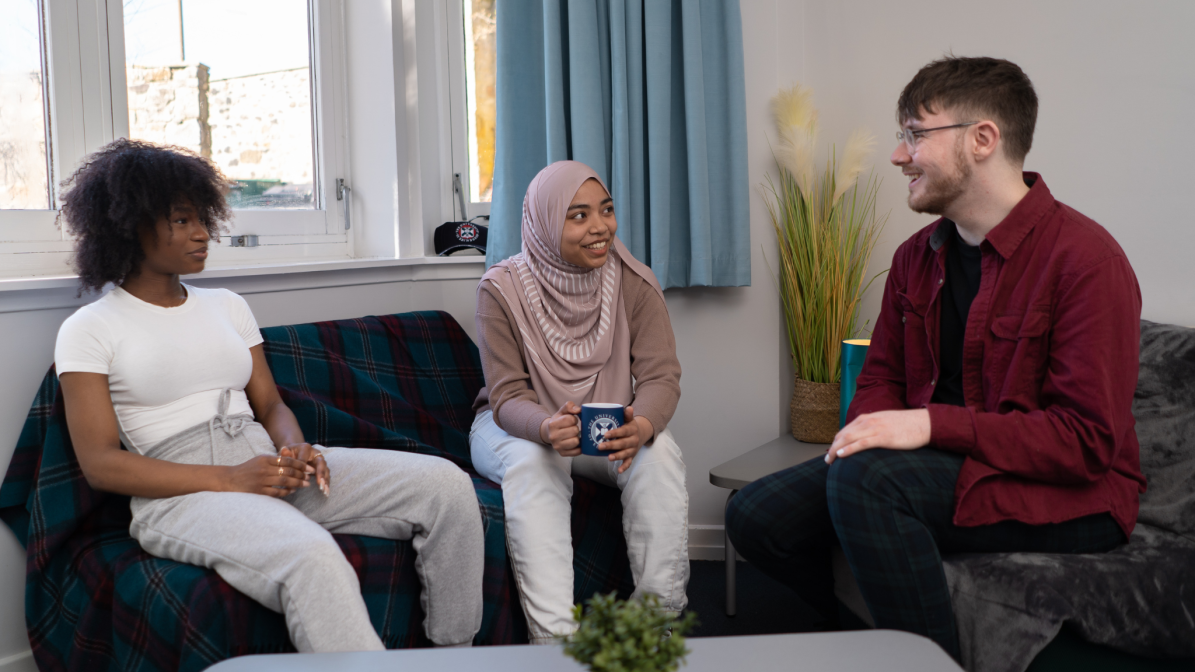 Industry_Marketing_Article_Accommodation_Marketing_Services_Image_1 A group of three students sat talking in student accommodation