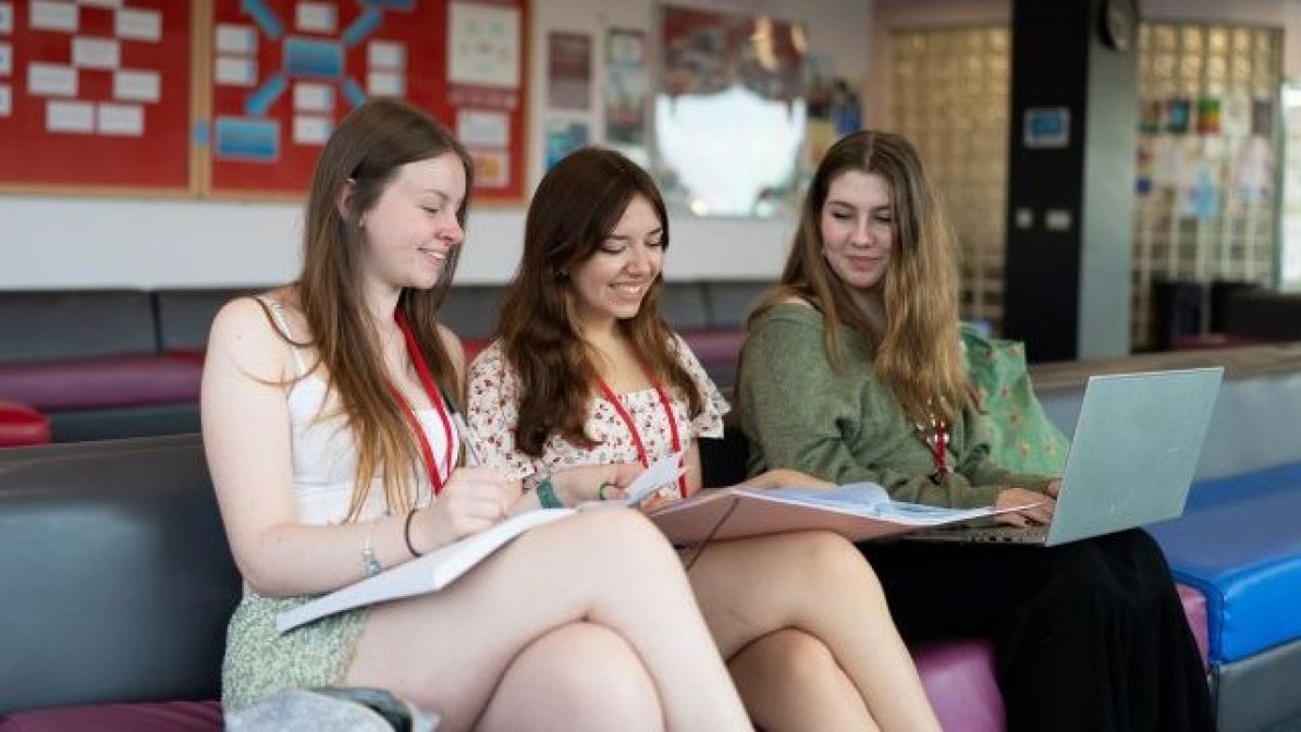 Students checking Clearing matches on laptop