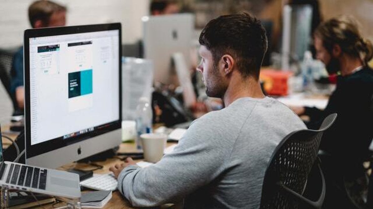 Design intern working on Mac