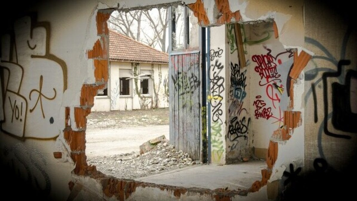 Derelict building with graffiti on walls