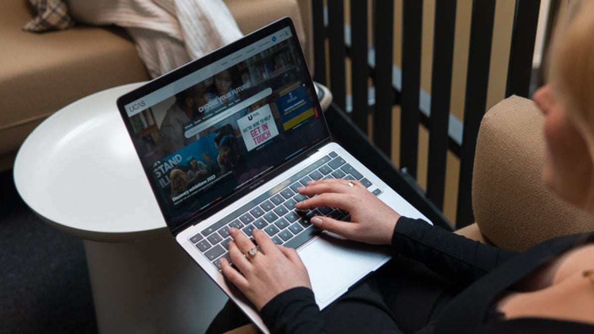 Student using the UCAS website on laptop