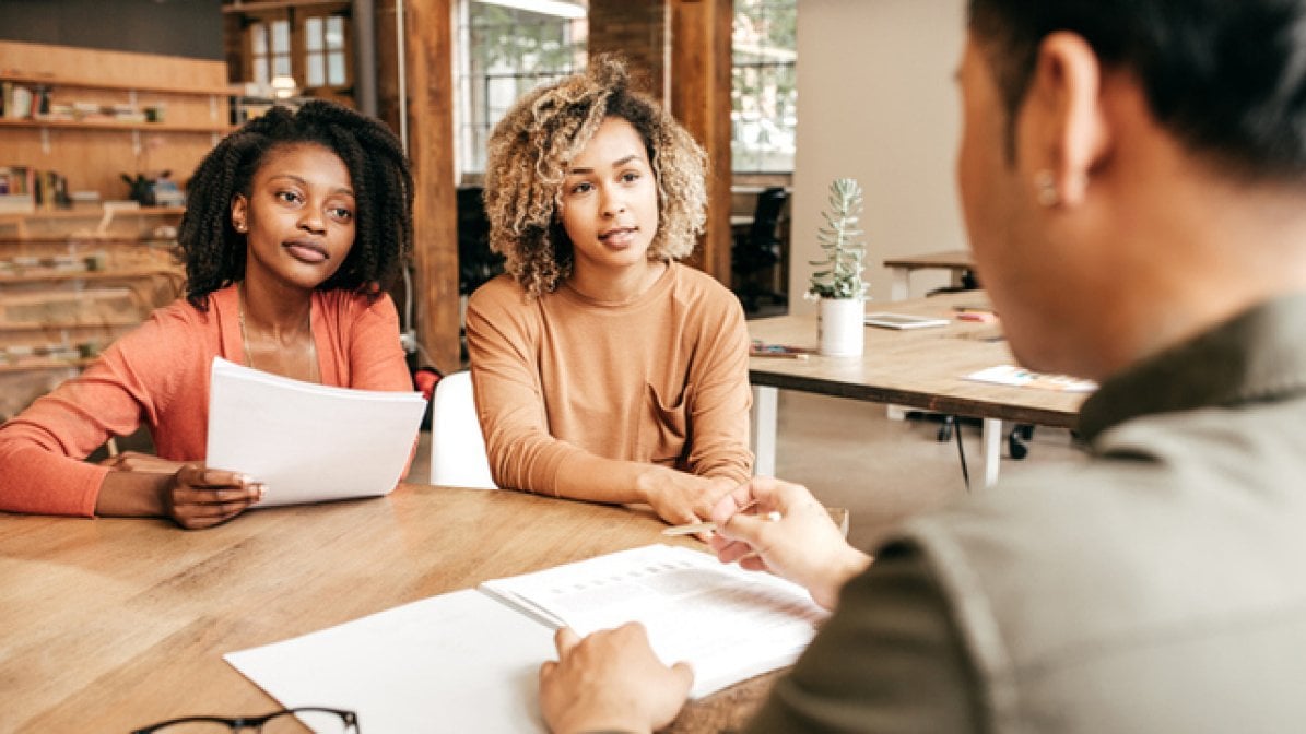Genetic counsellor talking to clients