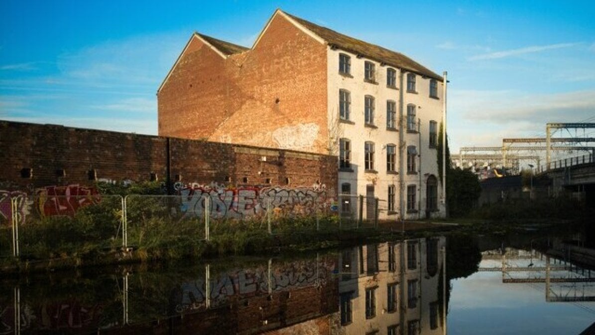 Building and its reflection in a river