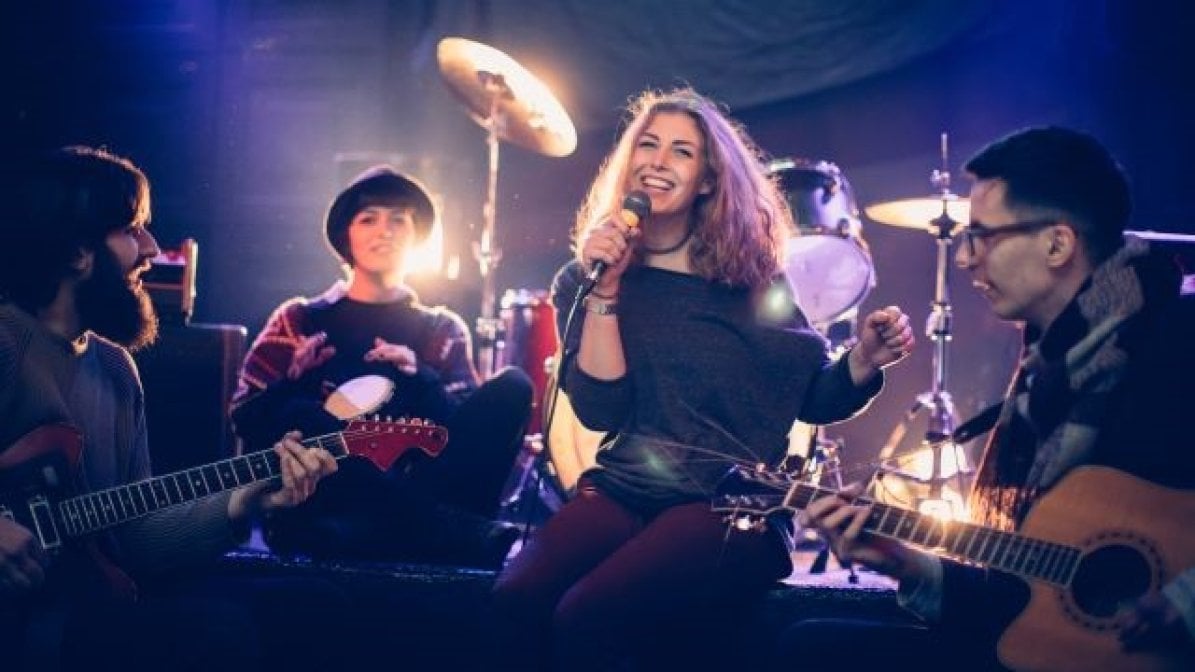 Students playing in a band on stage