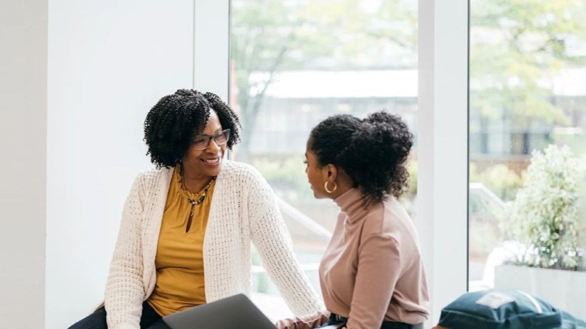 Adviser chatting to student