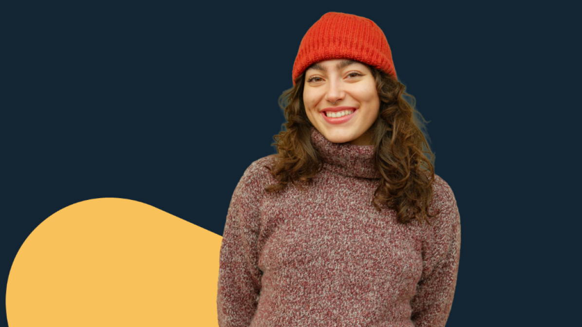 Student wearing a jumper and hat 