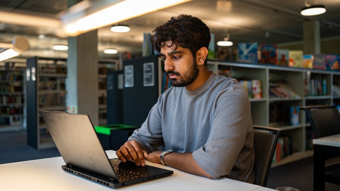 NVIDIA premium all round - student on laptop in library