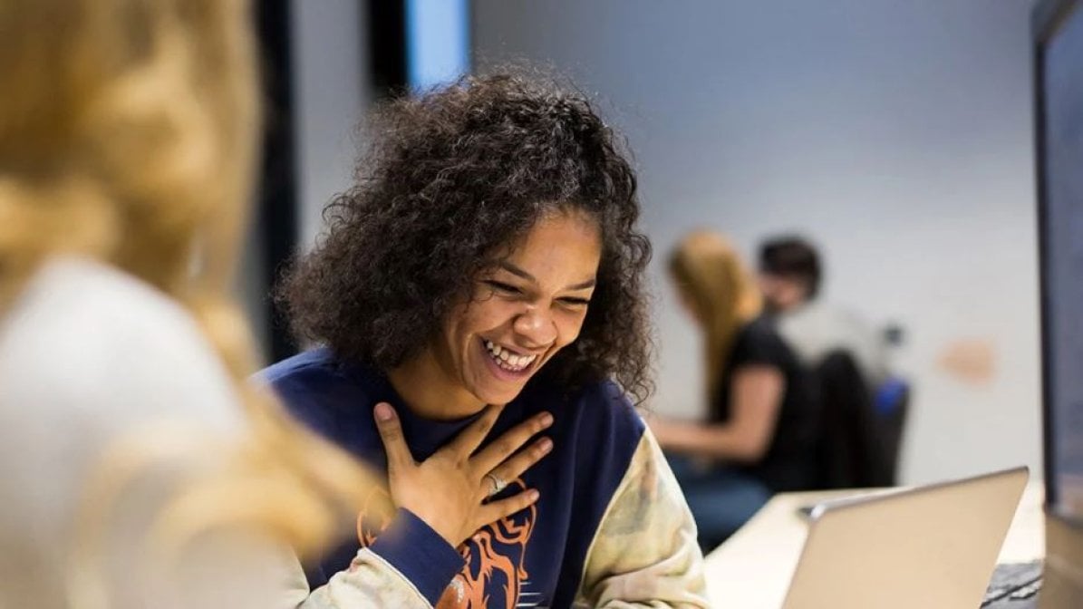 Laughing student in a classroom