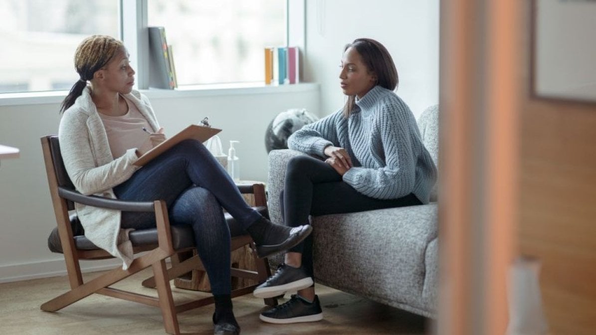 HE adviser talking to student