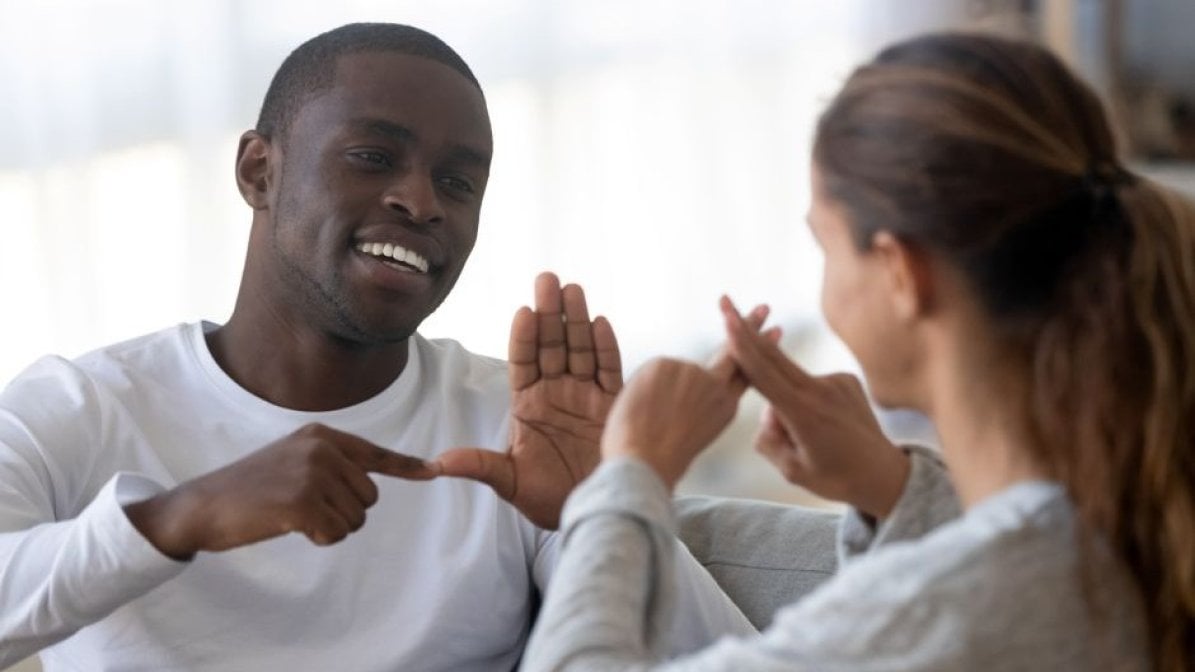 Deaf students signing to each other