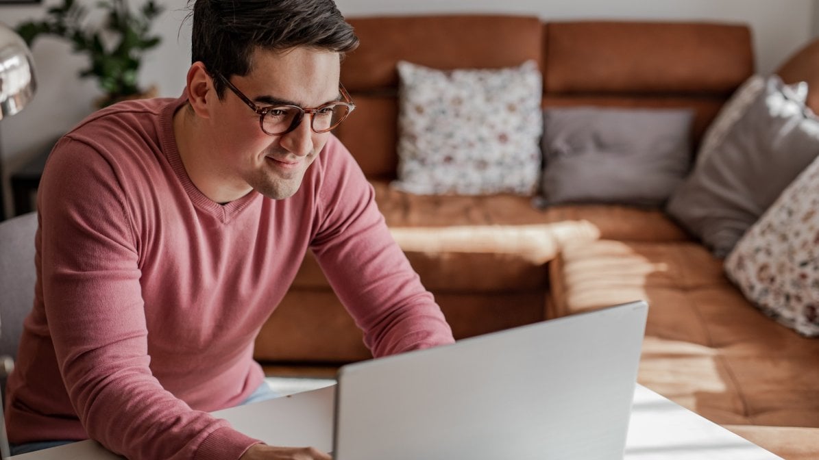 Man on laptop writing a CV