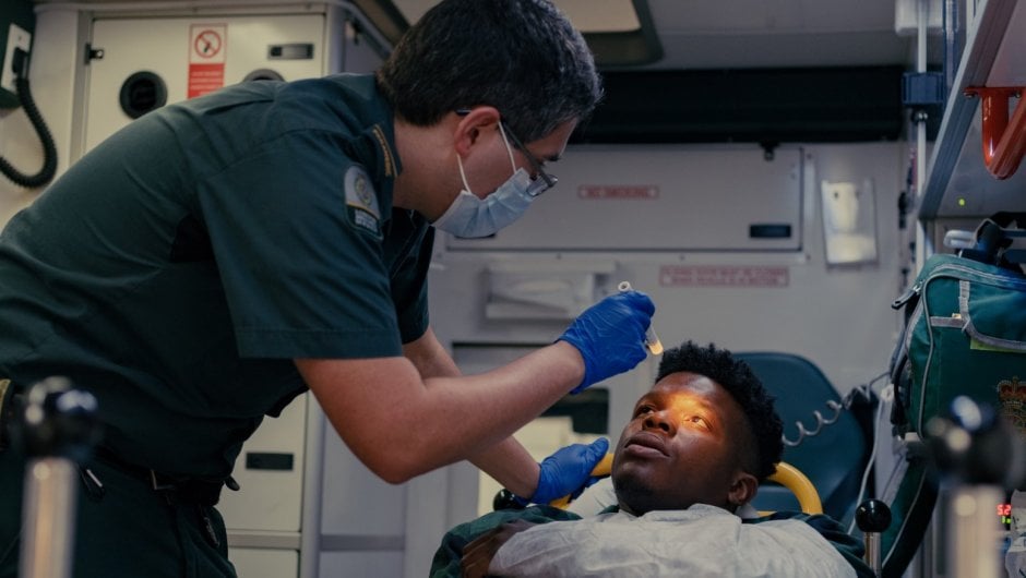 paramedic Paramedic treating patient in an ambulance