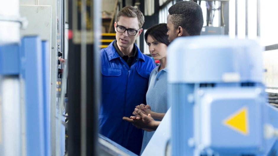 Mechanical engineering apprentices in workshop