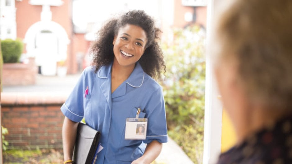 Care service apprentice visiting a client
