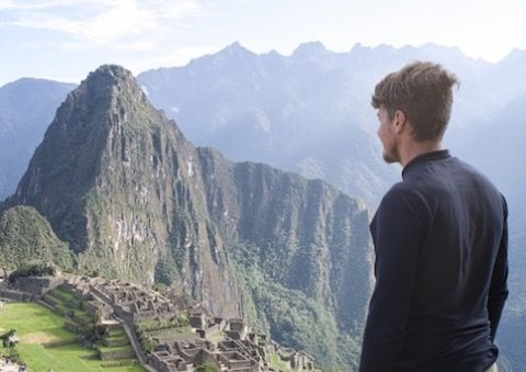 Student overlooking South American ruins