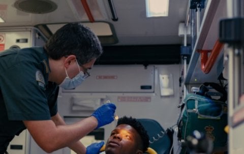 paramedic Paramedic treating patient in an ambulance