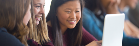 Students looking at a laptop