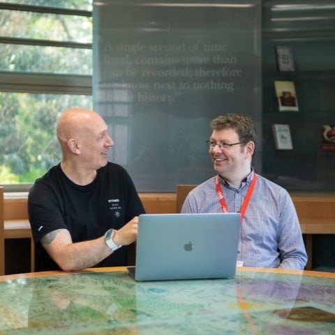 Advisers using laptop