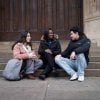 Students sitting on steps on uni campus